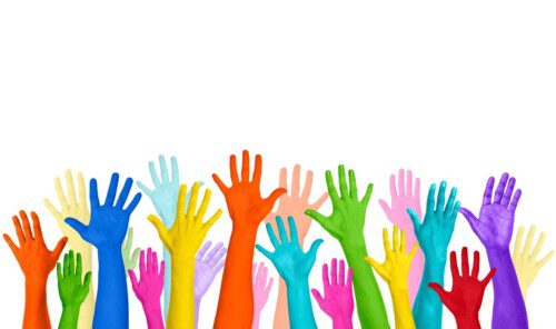 Bright multicolored raised hands against white