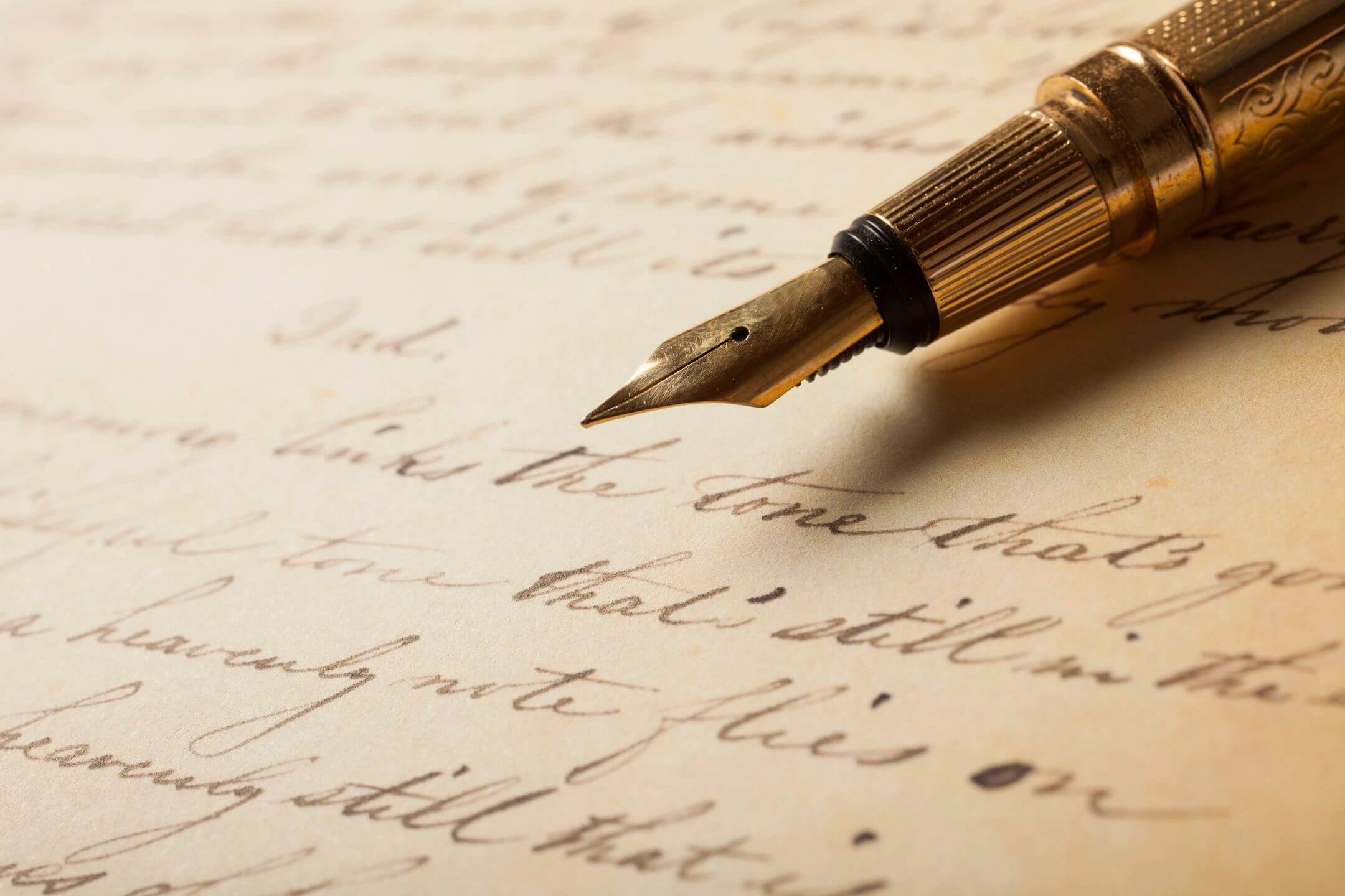 Vintage fountain pen on handwritten cursive letter